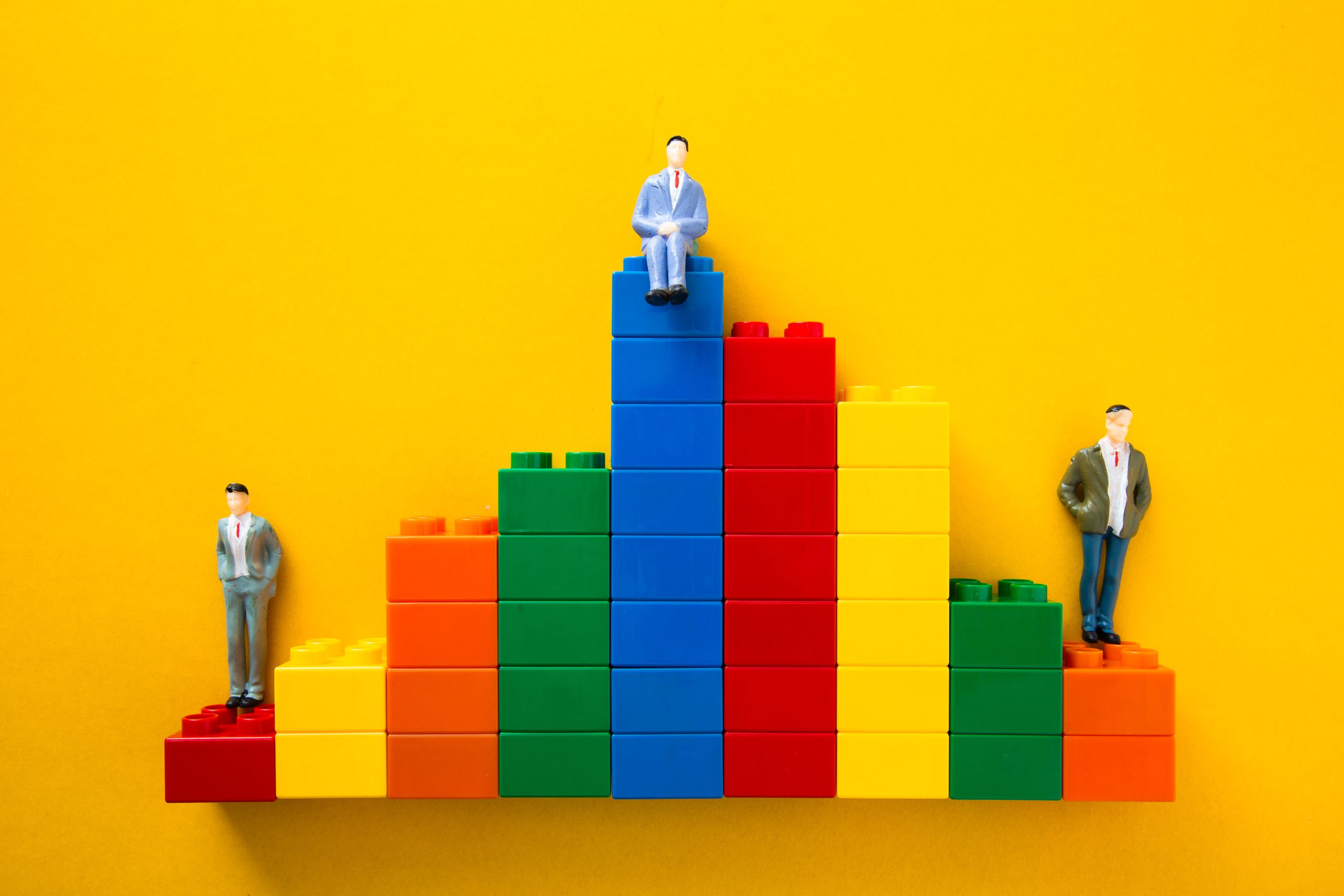 businessmen figurines standing and sitting on top 2025 01 10 00 22 05 utc scaled