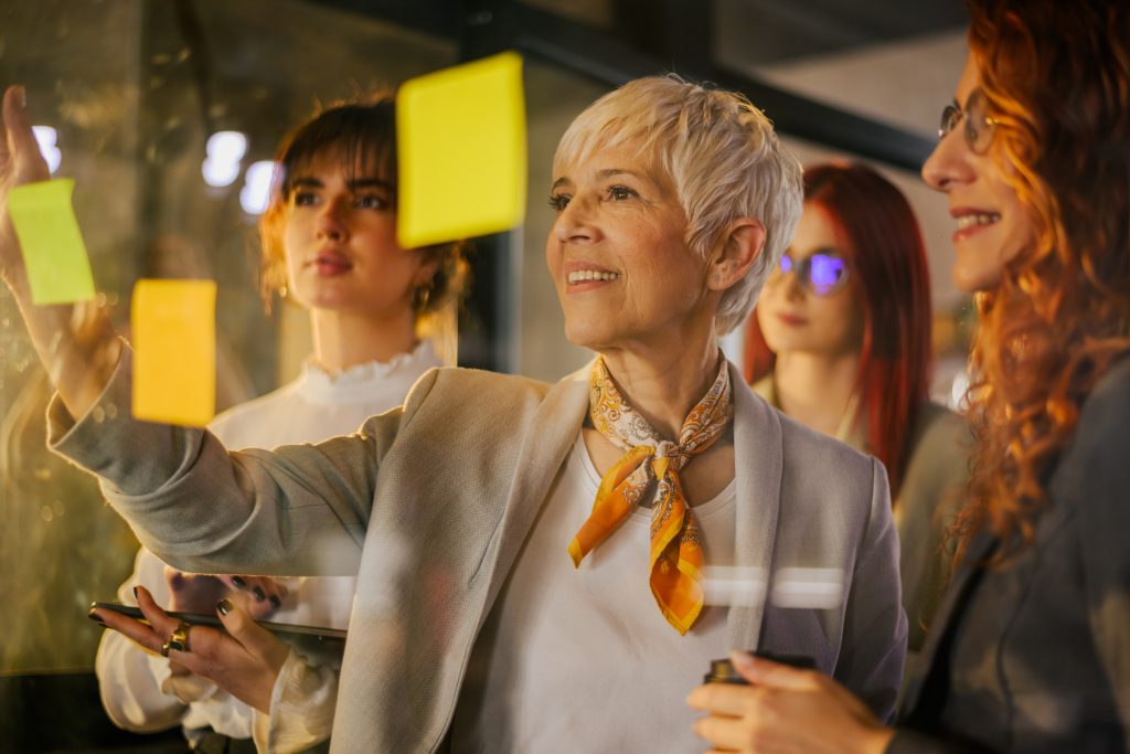 senior businesswoman with her team writing ideas o 2025 04 03 19 45 56 utc